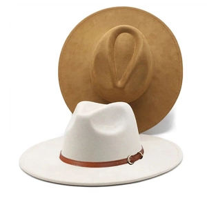 Detail of camel and beige suede fedora hats with wide brims and decorative leather bands