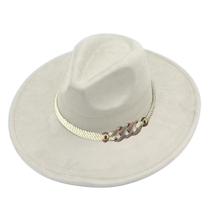 Detail of wide brim fedora hat with braided rope and antique bronze chain decoration