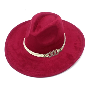 Detail of burgundy suede fedora featuring a woven rope band and rhinestone chain buckle