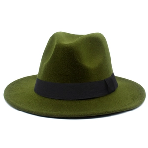 Detail of dark green felt fedora hat featuring a stylish black fabric decorative band