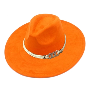 Close-up of orange suede fedora with braided rope trim and silver metal buckle detail
