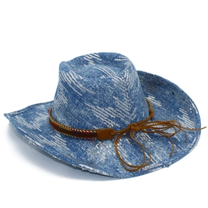 Detail of blue denim cowboy hat featuring silver sequins and brown leather band with stitching
