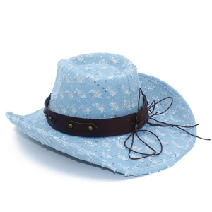 Close-up of light blue denim cowboy hat featuring silver sequins and rivet leather band
