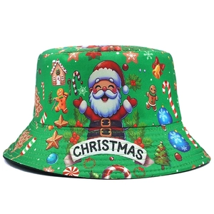 Green Christmas bucket hat with Santa print and white ribbon showing Christmas text