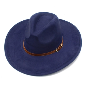 Detail of navy blue suede fedora featuring a brown leather band and gold buckle