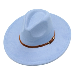 Detail of light blue faux suede fedora with brown leather strap and gold buckle