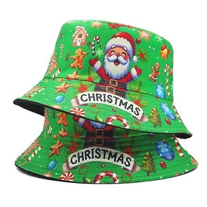 Detail view of the Christmas festive print pattern and text on the green bucket hat