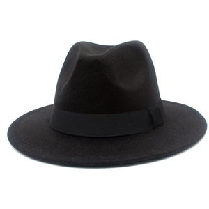 Detailed view of black fedora hat with matching fabric ribbon and smooth felt texture