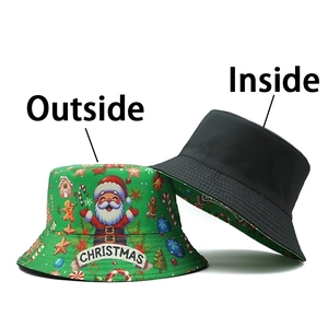 Reversible Christmas bucket hat showing green festive print outside and plain black inside