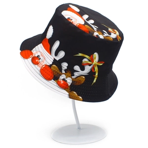 Detailed view of black Christmas bucket hat with festive Santa and reindeer cartoon prints