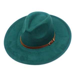 Detail of dark green wide-brim fedora with brown leather strap and gold metal buckle