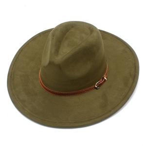 Macro detail of wide brim suede fedora hat with brown leather band and gold buckle