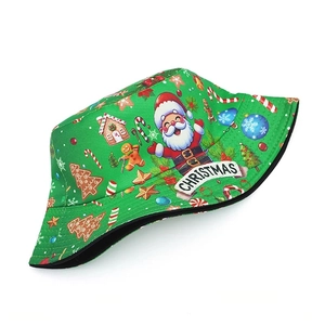 Detail of Christmas bucket hat showing Santa and gingerbread prints on green fabric