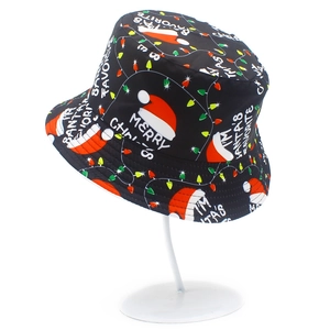 Detail of black Christmas bucket hat with festive print and merry slogans