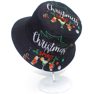 Close-up of black Christmas Spirit bucket hat with festive cocktail and candy cane prints