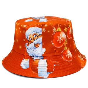 Detail of red Christmas bucket hat with festive Santa Claus and snowflake pattern
