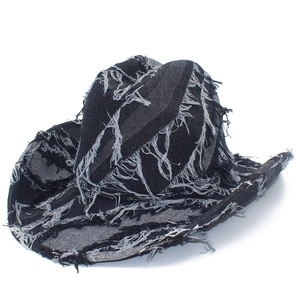 Distressed black denim cowboy hat with fringe details and wide brim for outdoor sun protection