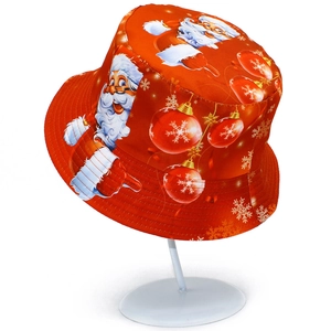 Detail of red Christmas bucket hat featuring festive Santa and snowflake patterns