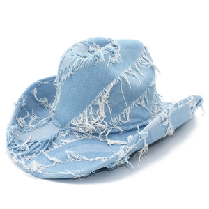 Distressed light blue denim cowboy hat with frayed edges and fringe for outdoor travel