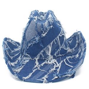 Distressed blue denim western cowboy hat with frayed fringe edges for outdoor fashion