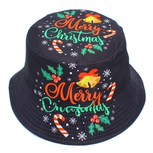 Detail of black Christmas bucket hat with Merry Christmas text and festive patterns
