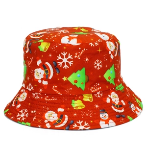Detail view of red Christmas bucket hat with festive Santa and snowman patterns