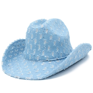 Distressed denim cowboy hat in light blue with silver sequins and stylish torn details