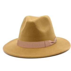 Detail of camel wool felt fedora featuring a matching satin ribbon and bow accent