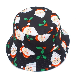 Detail view of black Christmas bucket hat featuring festive Santa and holly berry prints