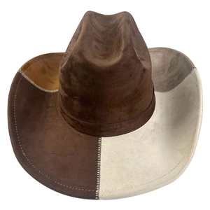 Detail of color-block cowboy hat with white contrast stitching on suede texture