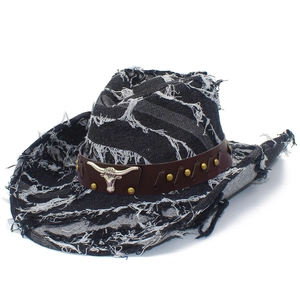 Classic black denim cowboy hat with frayed edges and silver bull head metal emblem