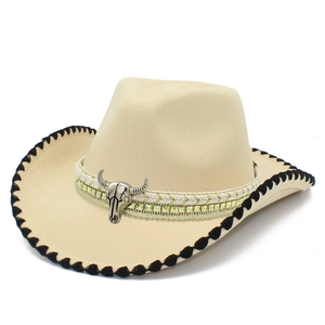 Classic beige felt cowboy hat with silver bull head emblem and braided brim detail