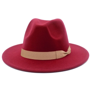 Detailed texture of burgundy fedora hat with a contrast khaki grosgrain ribbon band