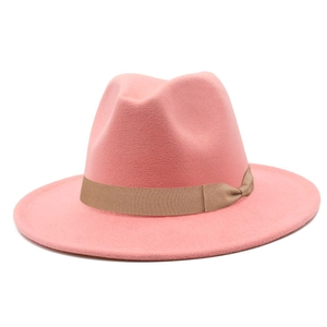 Detail of pink wool fedora hat featuring a brown grosgrain ribbon and classic bow