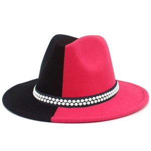 Detail of red and black bicolor wool fedora hat featuring double faux pearl headbands