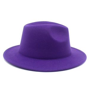 Detailed close-up of dark purple wool fedora hat with flat wide brim and structured crown