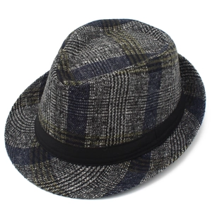 Detailed view of checkered wool fedora hat with black decorative ribbon band on white background