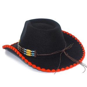 Detail of black felt cowboy hat featuring red trim and colorful beaded ethnic band