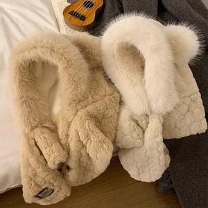 Detailed view of plush faux fur hooded scarf with thick soft texture in beige and khaki colors