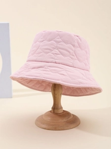 Detailed view of pink quilted heart patterns on soft fabric fisherman hat for women