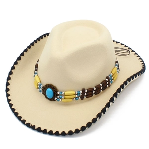 Detail of bohemian western fedora with ethnic beaded band and turquoise stone accent