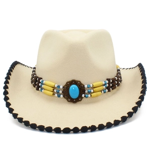 Detail of beige felt cowboy hat with ethnic beaded band and turquoise stone accent