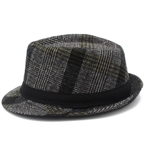 Detail of the vintage plaid fedora hat showing textured wool fabric and black ribbon band