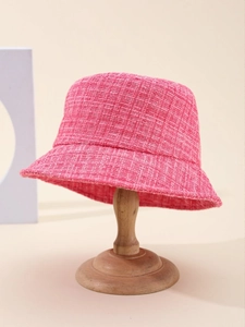 Detailed texture of vibrant pink tweed bucket hat with premium woven fabric material