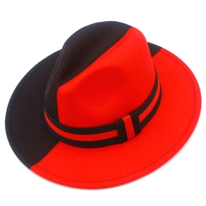Detail eines zweifarbigen Fedora-Hutes in Schwarz und Rot mit gestreiftem Band