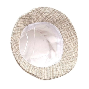 Detail view of woven plaid bucket hat showing inner lining and adjustable drawstring
