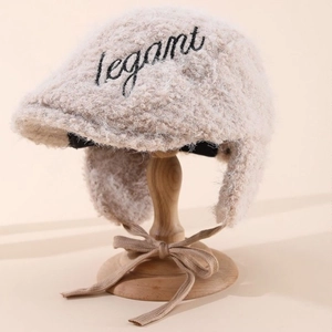 Plush beige newsboy cap with earflaps and elegant embroidery for autumn and winter