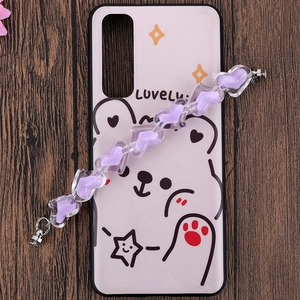 Detail view of a pink phone case featuring cartoon bear graphics and purple heart bead strap
