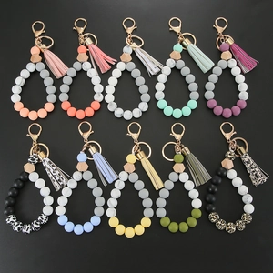 Silicone bead keychain bracelets with leopard spots and wooden hex beads in various colors