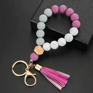 Silicone bead keychain wristlet with wooden bead, golden lobster clasp, and purple tassel